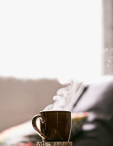 shallow focus photography of brown mug with smoke thumbnail