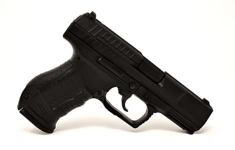 black semi-automatic pistol against white background thumbnail