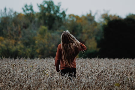 woman near trees during daytime thumbnail