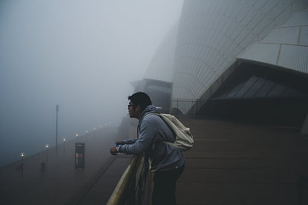 man standing near body of water thumbnail