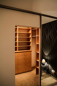 brown wooden cabinet near mirror thumbnail