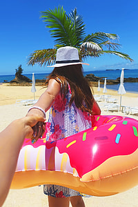 Person holding woman hand on the beach during day time thumbnail
