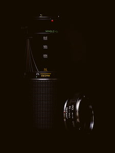 black camera lens on black surface thumbnail