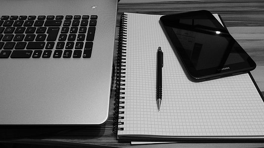black smartphone near pen thumbnail