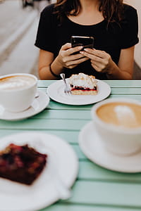 Drinking coffee and eating cake in a cafeteria thumbnail