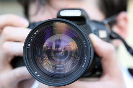 black DSLR camera thumbnail