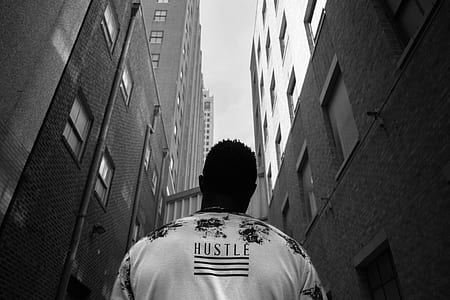 grayscale photo of man looking above thumbnail