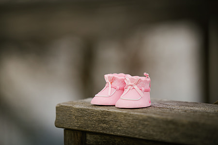toddler's pair of pink shoes in selective color photography thumbnail