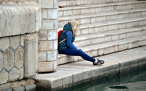 blonde haired woman in blue and green hoodie and blue pants thumbnail