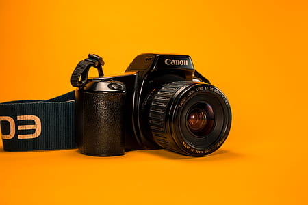 black Canon DSLR camera thumbnail