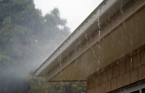 rainwater dripping on house roofs thumbnail