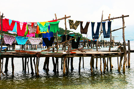 assorted-color clothes hanging above dock thumbnail