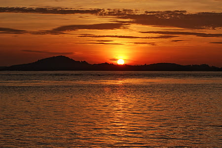 sun near mountain range during golden hour thumbnail