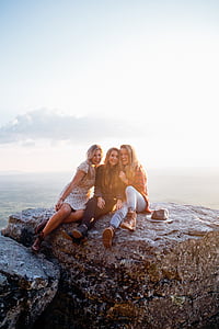 three women on rock at the cliff thumbnail