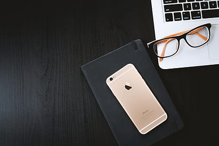 Working a black table with a laptop, smartphone and diary thumbnail