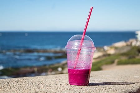 Clear Plastic Cup on Gray Concrete Surface thumbnail