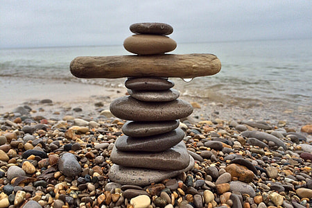 stone stack beside body of water thumbnail
