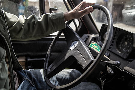 person touching steering wheel thumbnail