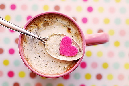 selective focus photography of pink mug filled with brown liquid thumbnail