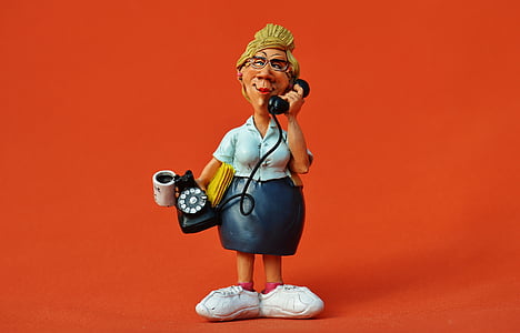 woman holding rotary telephone figurine thumbnail
