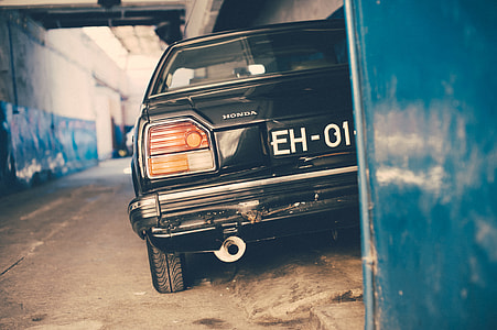 black car parked in an alley thumbnail