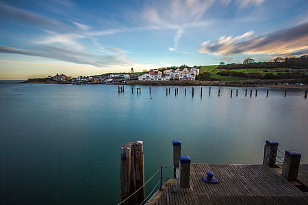 port on body of water near buildings thumbnail