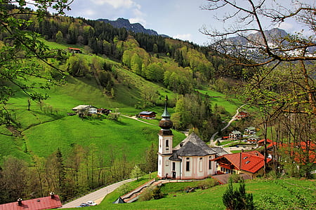 chapel near houses away from trees thumbnail