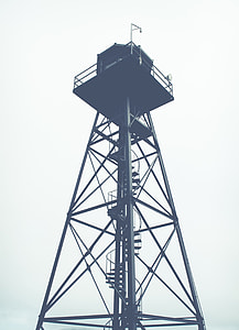 grey scale photo of light tower thumbnail