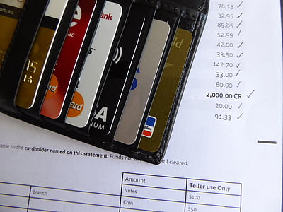 black leather card holder showing assorted cards on receipt paper thumbnail