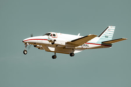 white airplane flying in the sky thumbnail