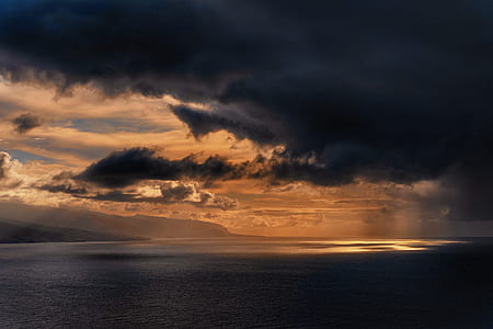 body of water during sunset thumbnail
