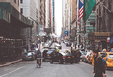 man crossing on street during daytime thumbnail