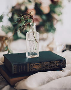 glass vase on black book thumbnail