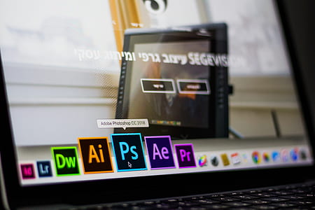 Turned on Laptop on Desktop With Hovered Adobe Photoshop Cc Application thumbnail