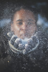 woman taking picture in front of glass panel thumbnail