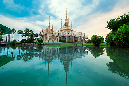 white traditional house near lake thumbnail