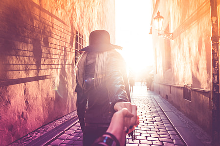 Young Woman Presents Follow Me To Pose in Prague Streets thumbnail