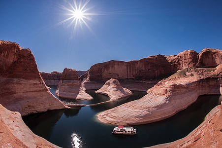landscape photography of lake and hill at daytime thumbnail