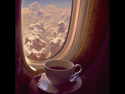 white ceramic mug beside airlplane window thumbnail