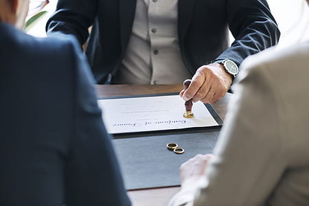 person putting stamp on document paper thumbnail