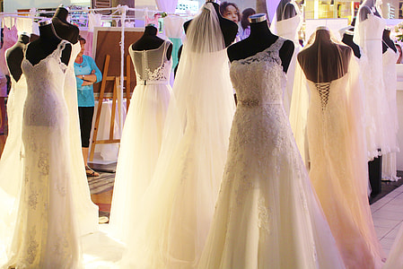 Mannequins showing off different bridal gowns in store thumbnail