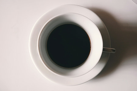 white ceramic tea cup filled with coffee thumbnail