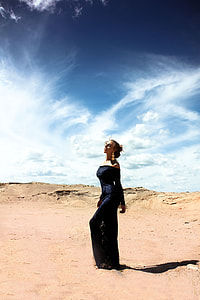 woman wearing black off-shoulder dress in the desert thumbnail