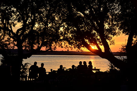 silhouette photography of people during sunset thumbnail