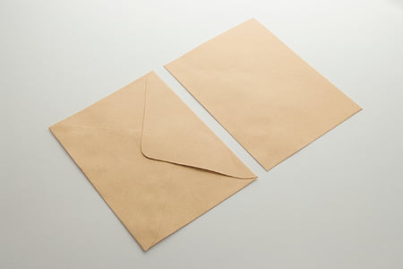 two brown envelopes on white panel thumbnail