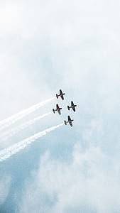 four jet planes up in the sky thumbnail