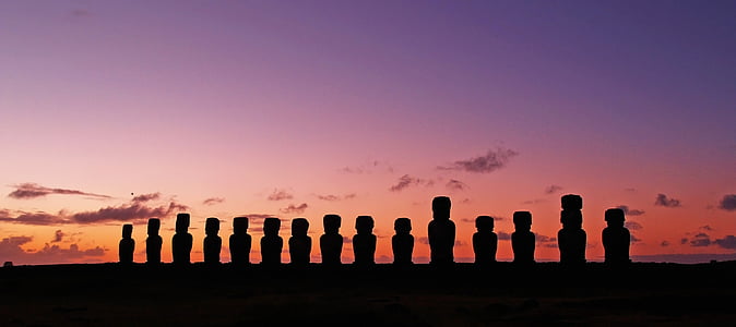 panoramic photo of Moai statues during golden hour thumbnail