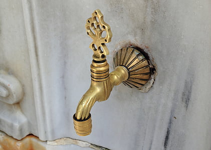 shallow focus photo of gold faucet thumbnail