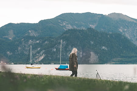 Young Woman Walking on the River Side in Fall thumbnail