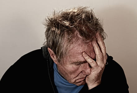 man wearing black jacket hand on face thumbnail